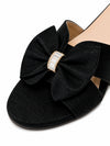Close up of black fabric bow and crystal accent on ZAYRA flat slide