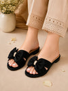 ZAYRA black bow flat slides for women worn with beige trousers