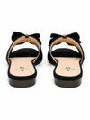 Back view of ZAYRA black bow flat slides showing textured sole