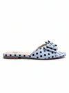 Side profile view of ZAYRA ladies blue polka dot flat slide slipper with front bow accent