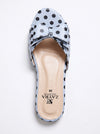 A single light blue mule sandal with black polka dots, featuring a large bow detail across the top and a beige insole with the brand name ZAYRA visible.