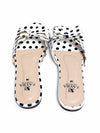 Back view of ZAYRA white polka dot flat slippers with dark brown sole